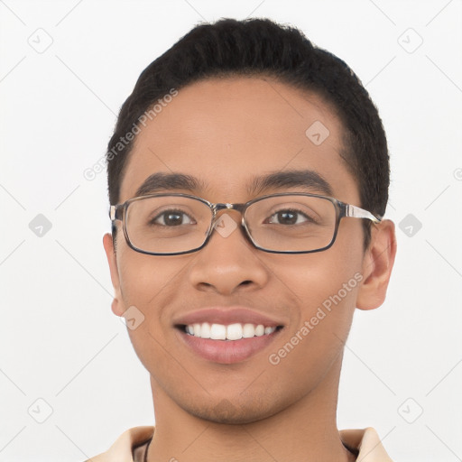 Joyful latino young-adult male with short  black hair and brown eyes