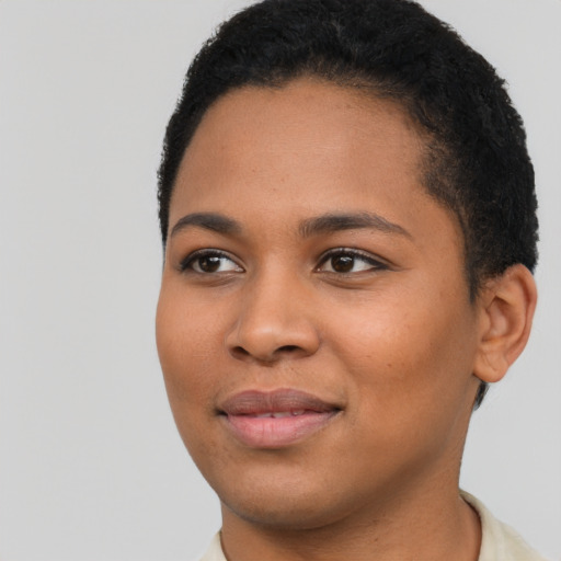 Joyful latino young-adult female with short  black hair and brown eyes