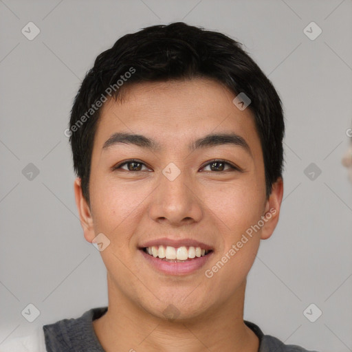 Joyful asian young-adult male with short  black hair and brown eyes