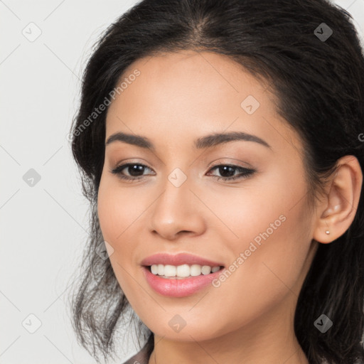 Joyful latino young-adult female with long  brown hair and brown eyes