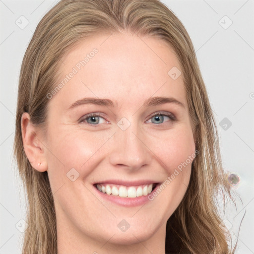 Joyful white young-adult female with long  brown hair and grey eyes