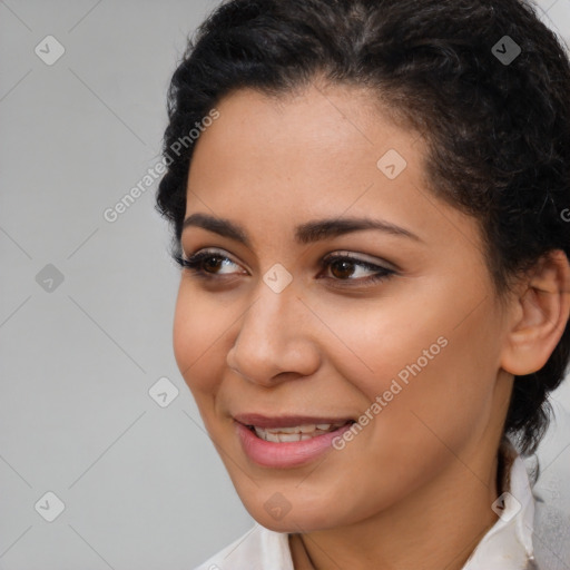 Joyful latino young-adult female with short  brown hair and brown eyes