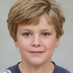 Joyful white child male with short  brown hair and grey eyes