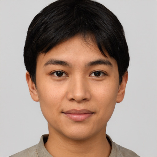 Joyful asian young-adult female with short  black hair and brown eyes