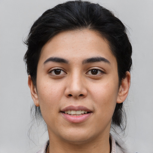 Joyful asian young-adult female with short  black hair and brown eyes