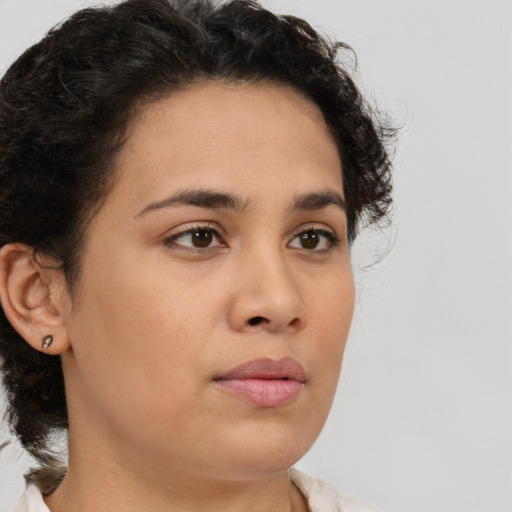 Neutral latino young-adult female with medium  brown hair and brown eyes