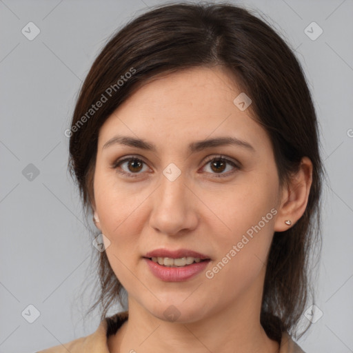 Joyful white adult female with medium  brown hair and brown eyes