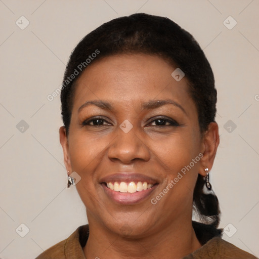 Joyful black adult female with short  brown hair and brown eyes