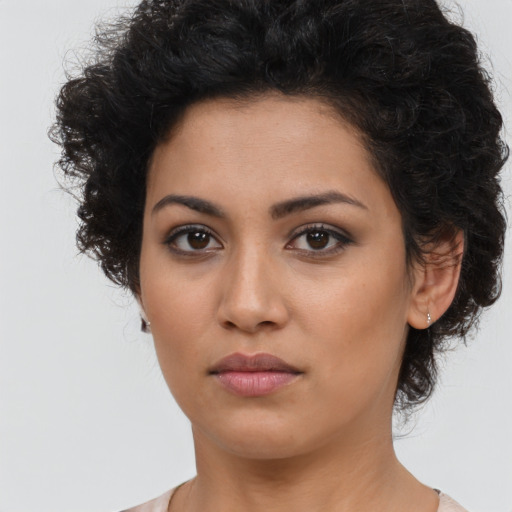 Neutral latino young-adult female with long  brown hair and brown eyes