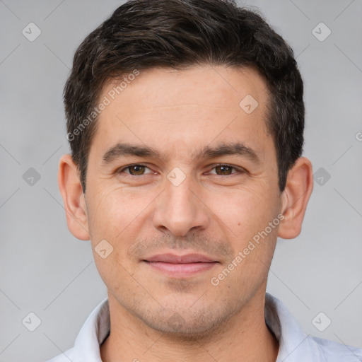 Joyful white young-adult male with short  brown hair and brown eyes