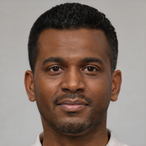 Neutral black young-adult male with short  black hair and brown eyes