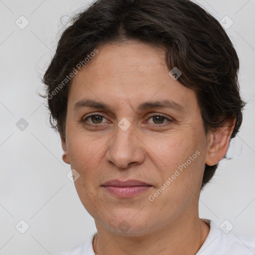 Joyful white adult female with short  brown hair and brown eyes