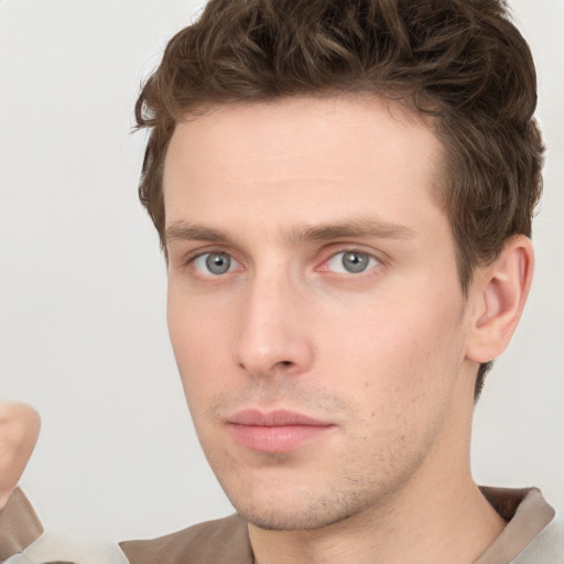 Neutral white young-adult male with short  brown hair and grey eyes