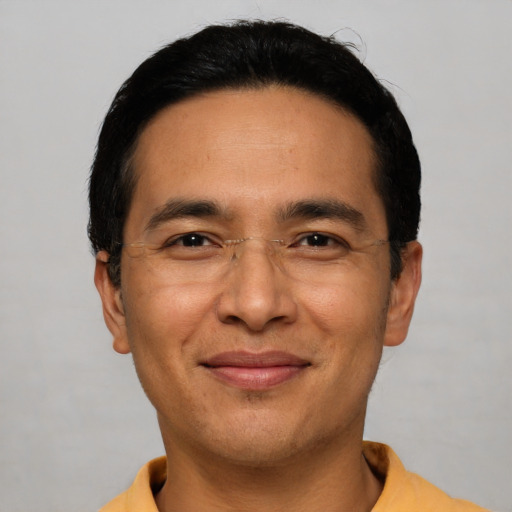 Joyful asian adult male with short  black hair and brown eyes