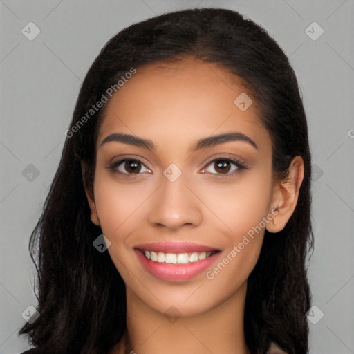 Joyful latino young-adult female with long  black hair and brown eyes