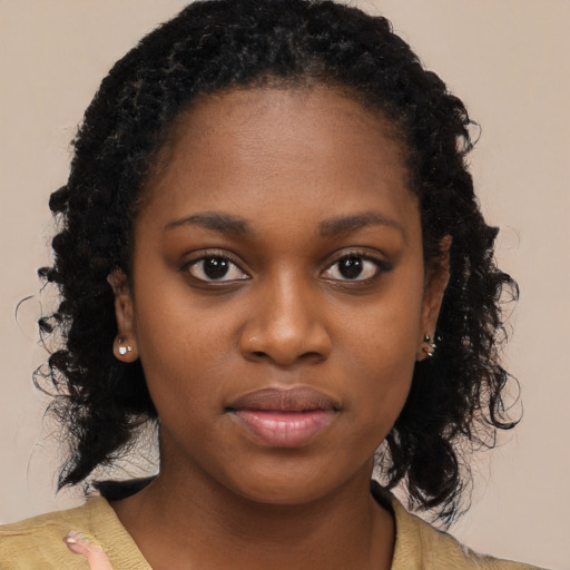 Neutral black young-adult female with medium  black hair and brown eyes