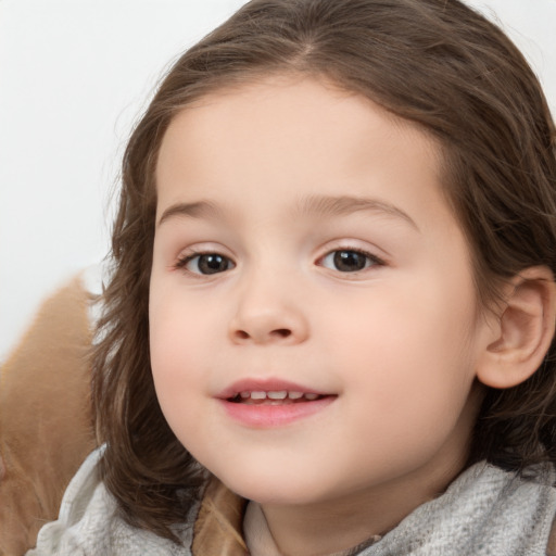 Joyful white child female with medium  brown hair and brown eyes