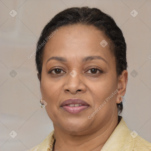 Joyful latino adult female with short  brown hair and brown eyes