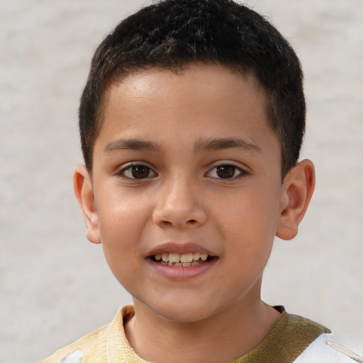 Joyful white child male with short  brown hair and brown eyes