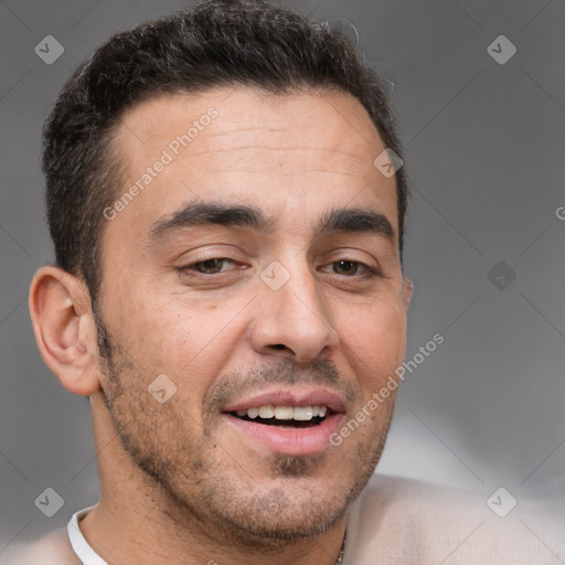 Joyful white adult male with short  brown hair and brown eyes