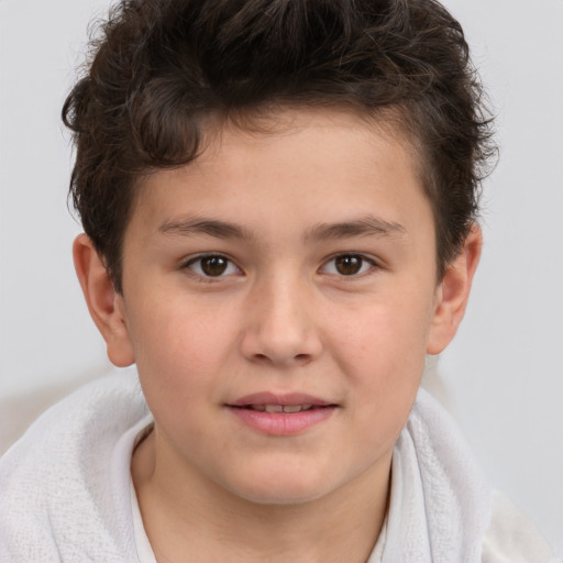 Joyful white child male with short  brown hair and brown eyes