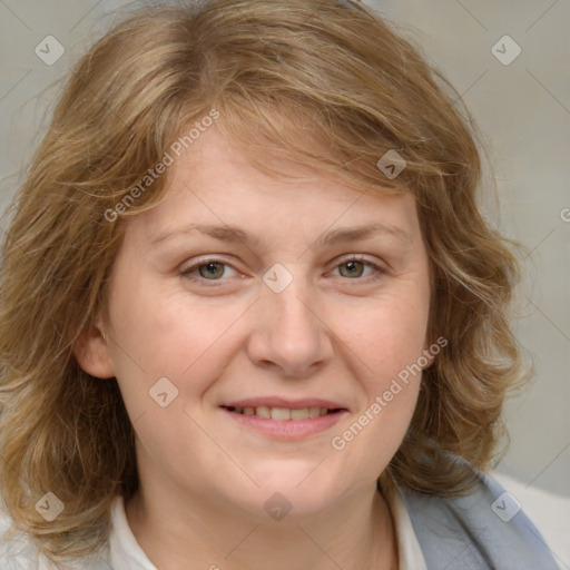 Joyful white adult female with medium  brown hair and blue eyes