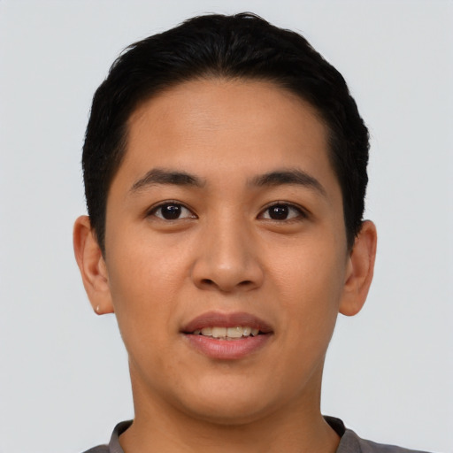 Joyful asian young-adult male with short  brown hair and brown eyes