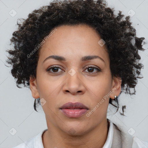 Joyful black adult female with short  brown hair and brown eyes