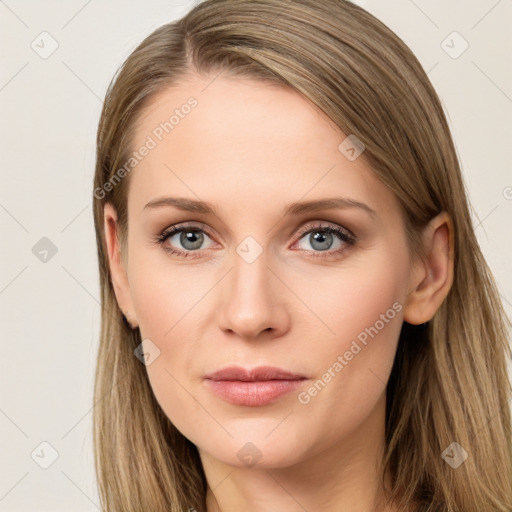 Joyful white young-adult female with long  brown hair and blue eyes