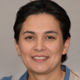 Joyful white adult female with medium  brown hair and brown eyes