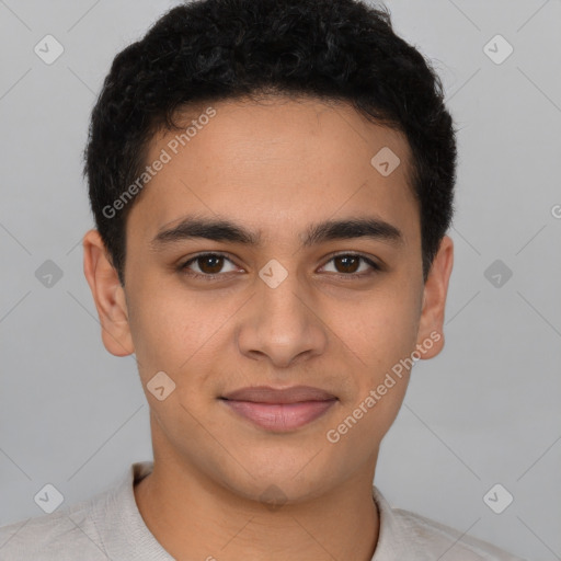 Joyful latino young-adult male with short  brown hair and brown eyes