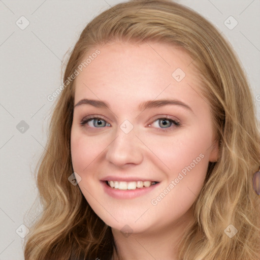 Joyful white young-adult female with long  brown hair and blue eyes