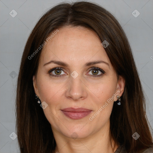 Joyful white adult female with long  brown hair and brown eyes