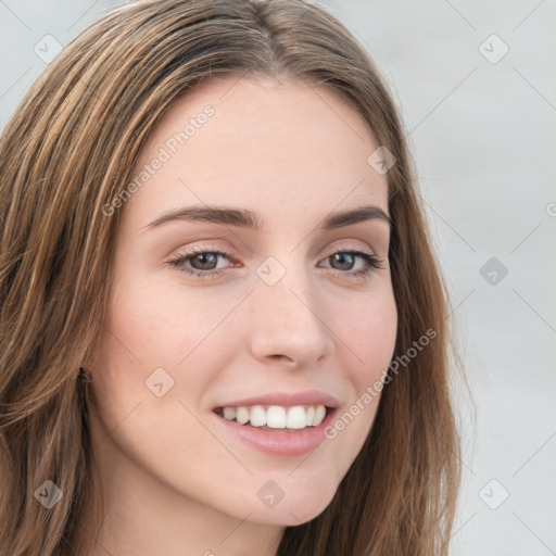 Joyful white young-adult female with long  brown hair and green eyes