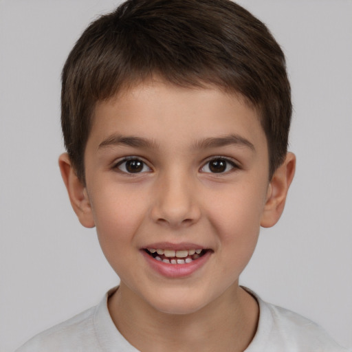 Joyful white child male with short  brown hair and brown eyes