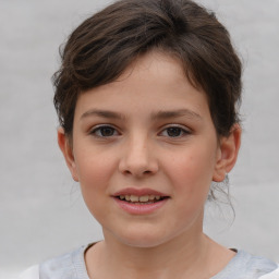 Joyful white child female with short  brown hair and brown eyes