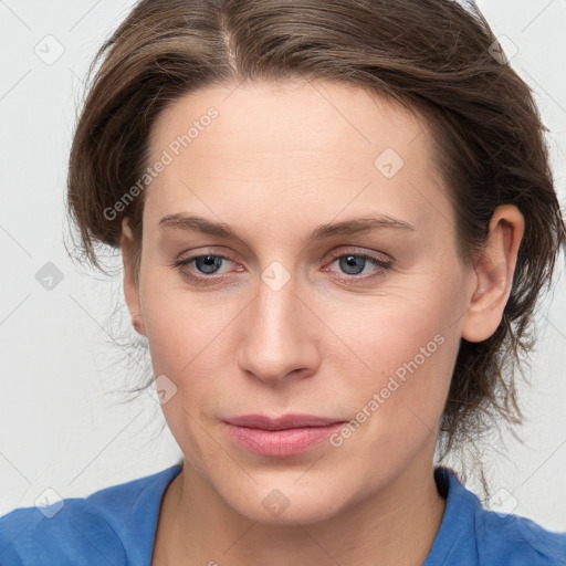 Joyful white young-adult female with medium  brown hair and blue eyes