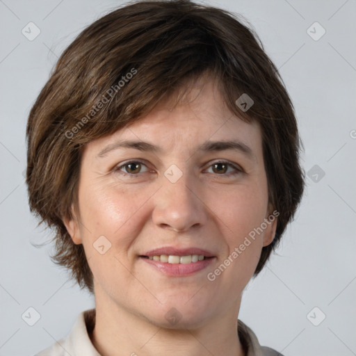 Joyful white adult female with short  brown hair and grey eyes