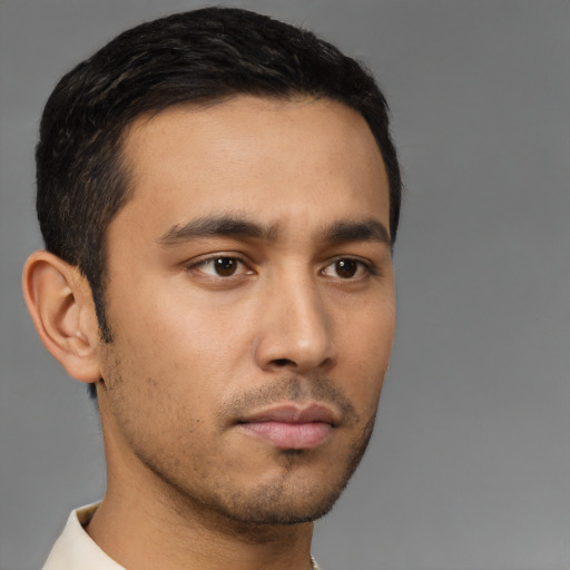 Neutral latino young-adult male with short  brown hair and brown eyes