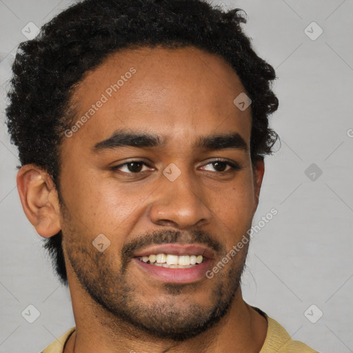 Joyful black young-adult male with short  brown hair and brown eyes