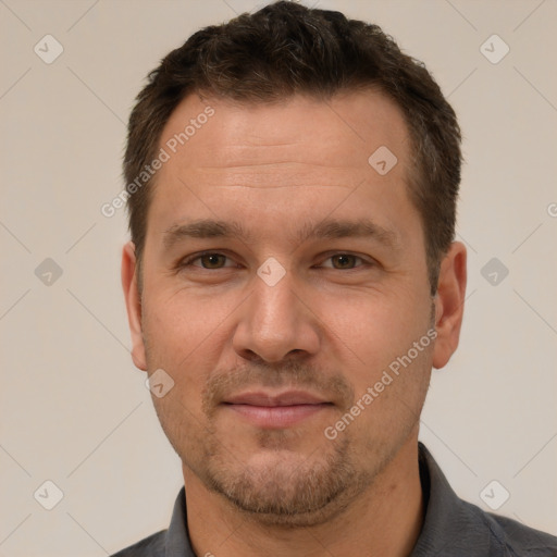 Joyful white adult male with short  brown hair and brown eyes