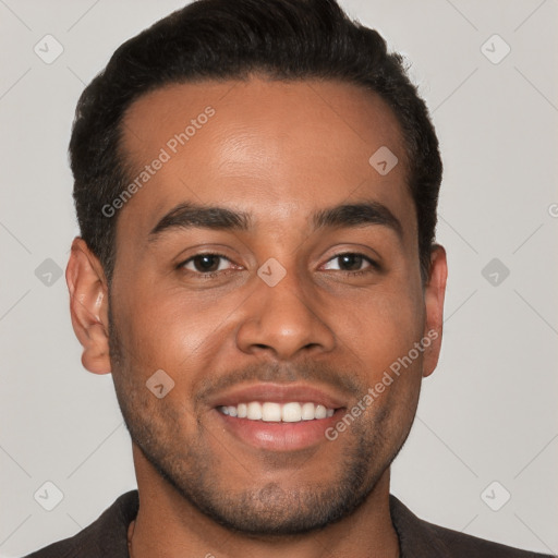 Joyful white young-adult male with short  black hair and brown eyes