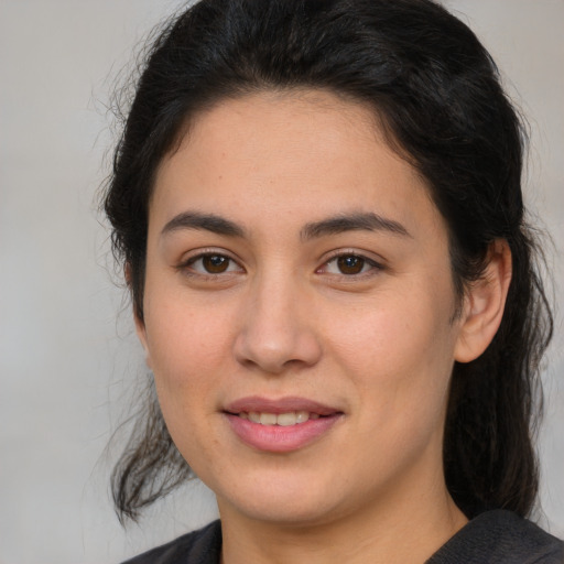 Joyful white young-adult female with medium  brown hair and brown eyes