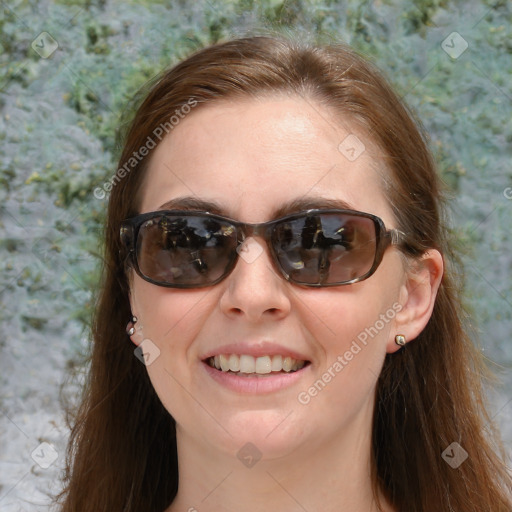 Joyful white young-adult female with long  brown hair and blue eyes