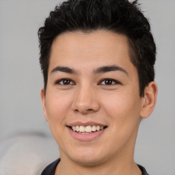 Joyful asian young-adult male with short  brown hair and brown eyes