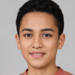 Joyful latino young-adult male with short  brown hair and brown eyes