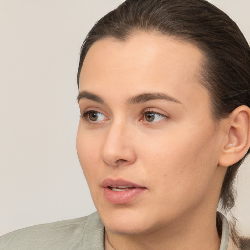 Neutral white young-adult female with medium  brown hair and brown eyes