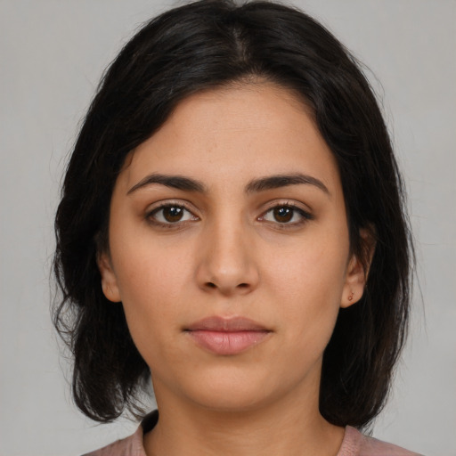Neutral latino young-adult female with medium  brown hair and brown eyes