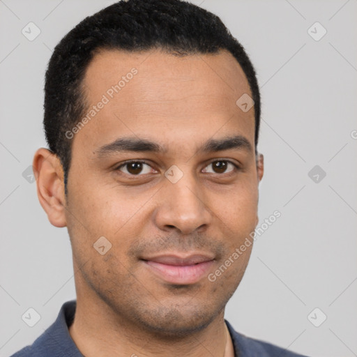 Joyful latino young-adult male with short  brown hair and brown eyes