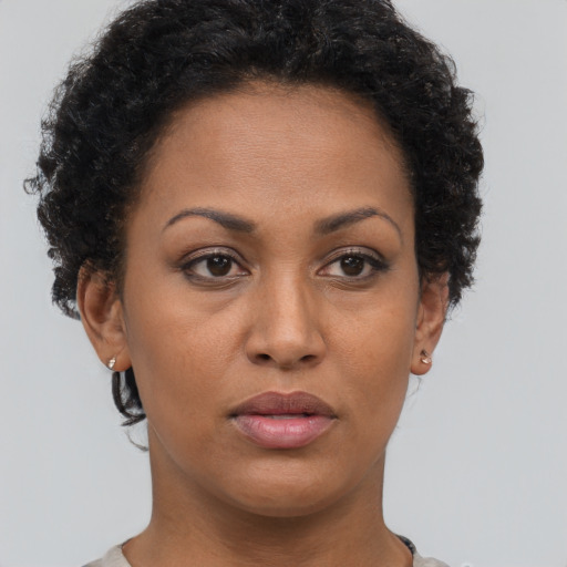 Neutral black young-adult female with short  brown hair and brown eyes